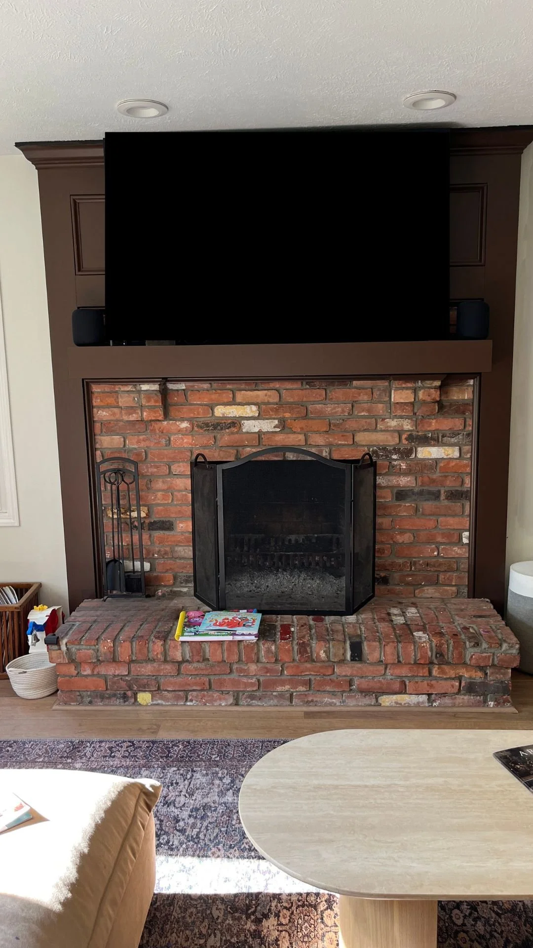 Photo of living room brick fireplace before S. FLynn Design + Build remodel