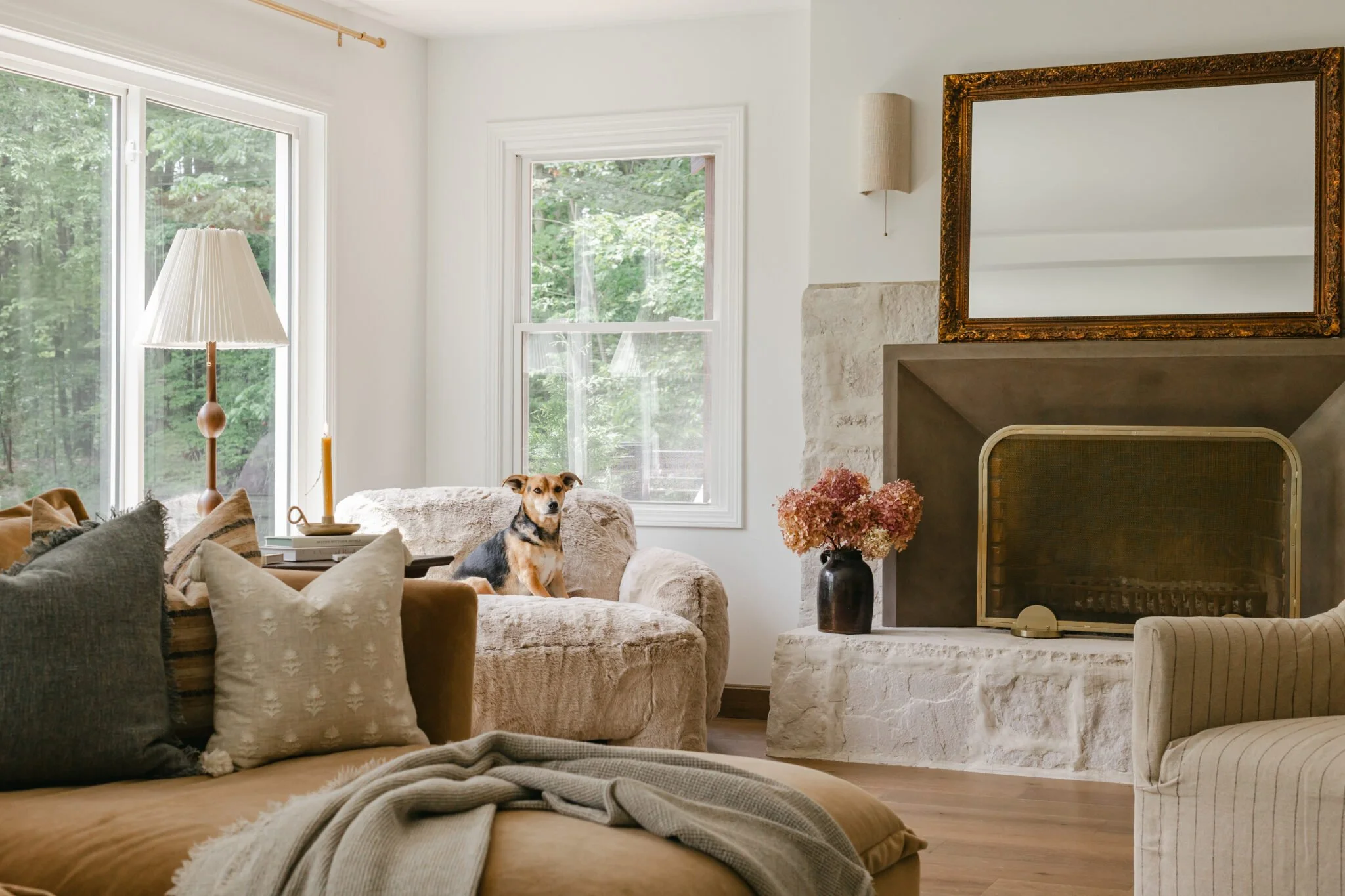 Soft and cozy furniture and wooden lamp styling in living room remodel by S. Flynn Design + Build