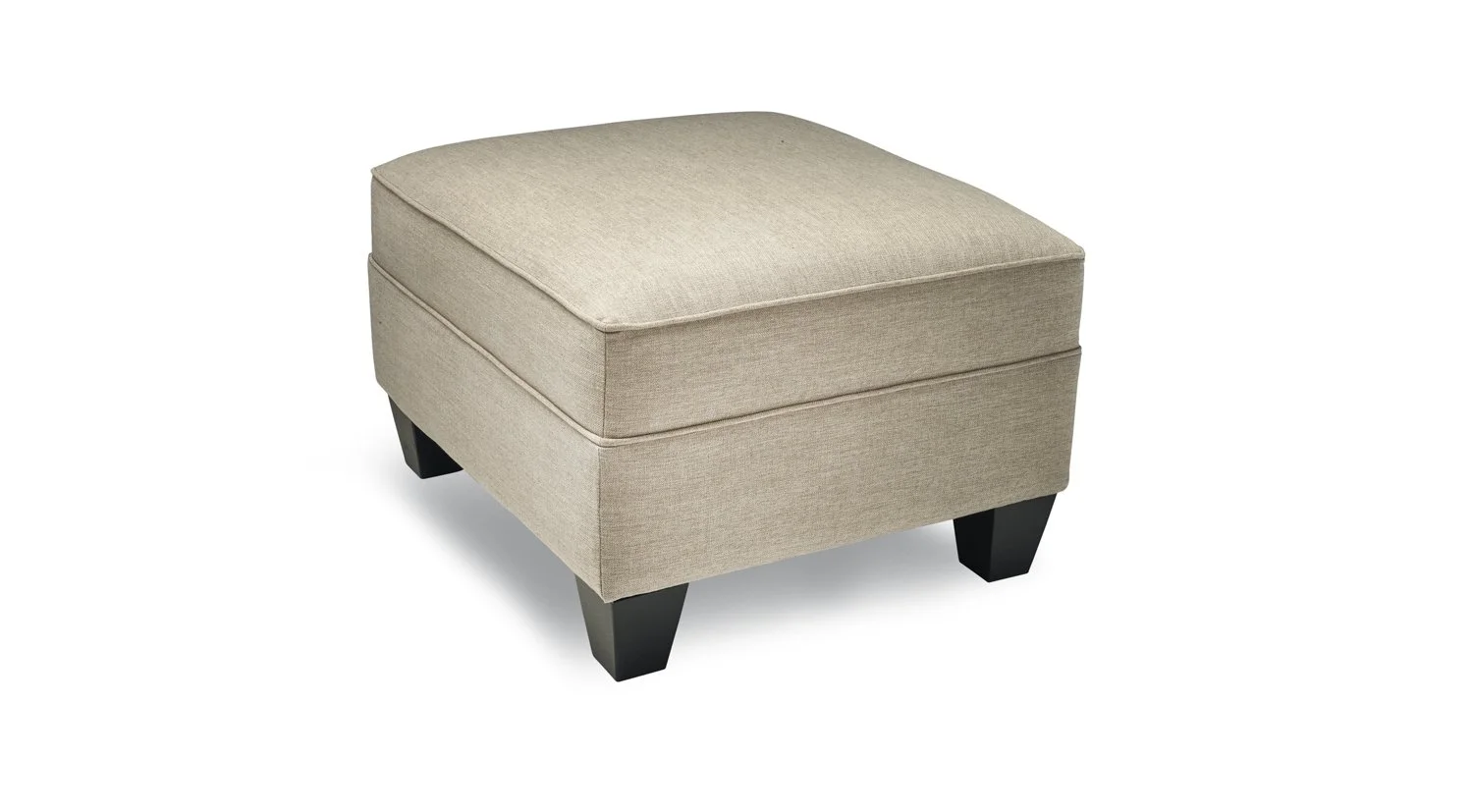 A beige upholstered ottoman with black wooden legs.