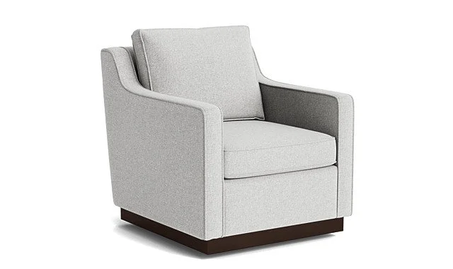 A light grey upholstered armchair with a cushioned seat, back, and armrests, and a dark wooden base.