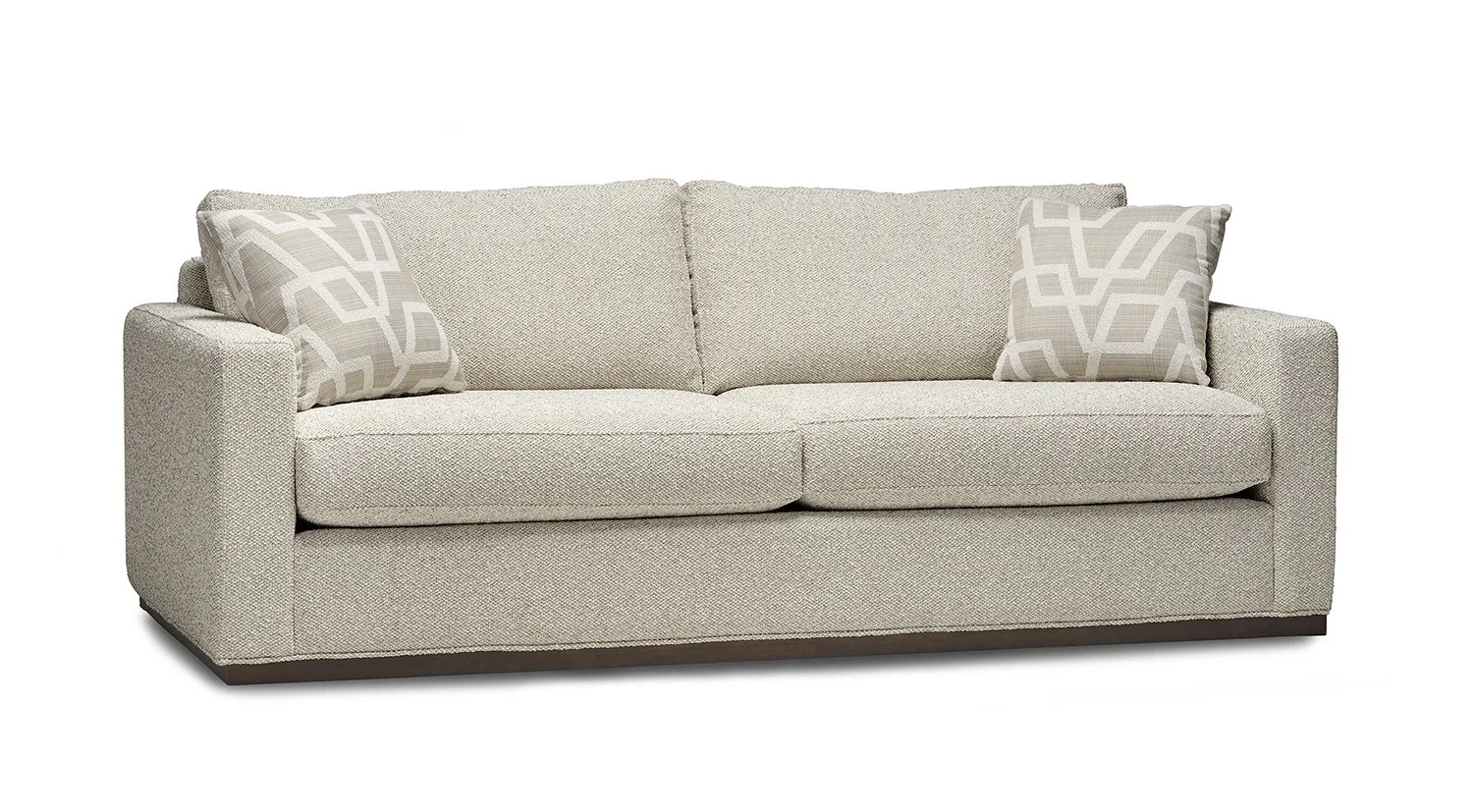 A beige upholstered sofa with two patterned throw pillows