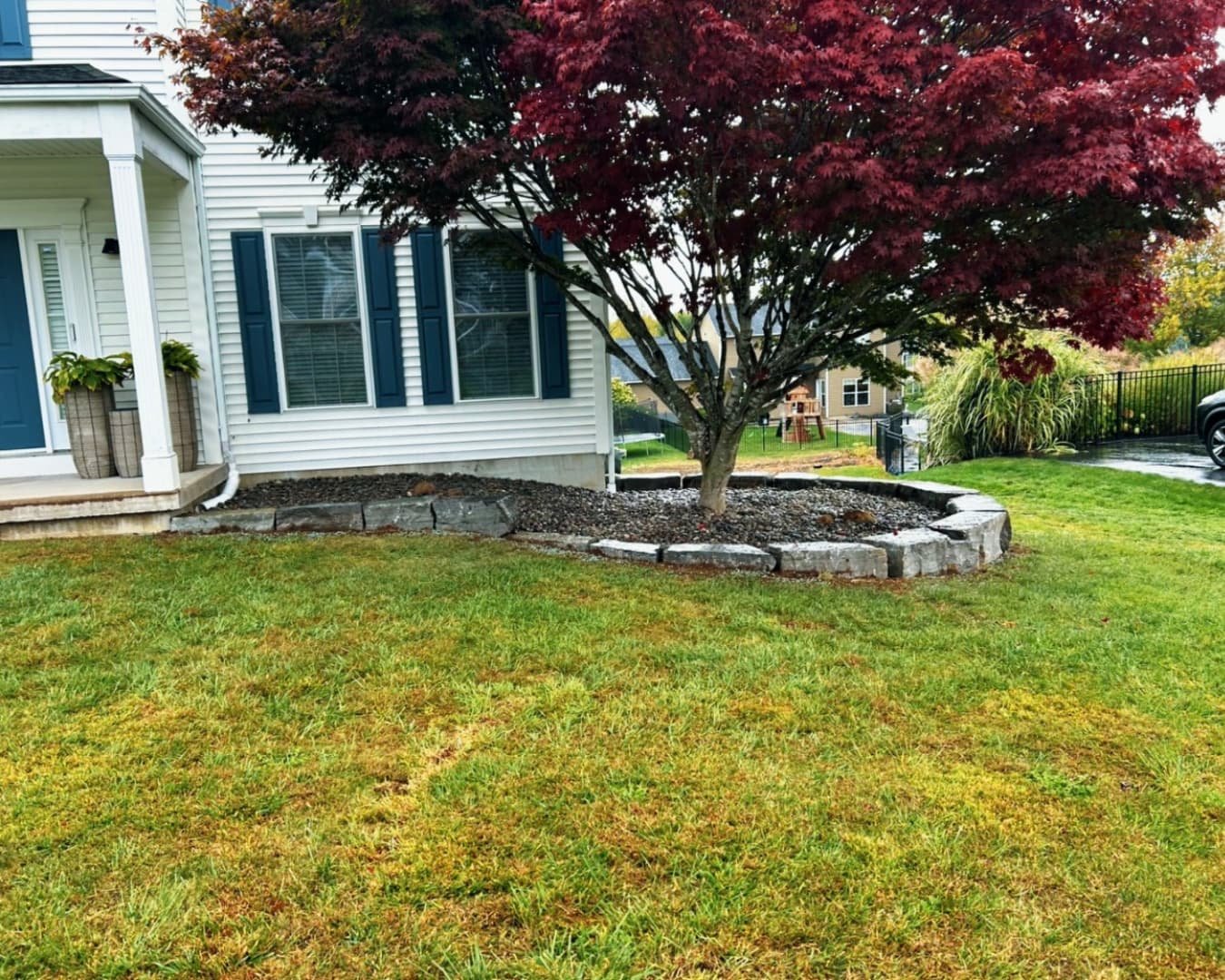 New mulch bed installation at a Central New York home with clean edging and fresh front yard landscaping.