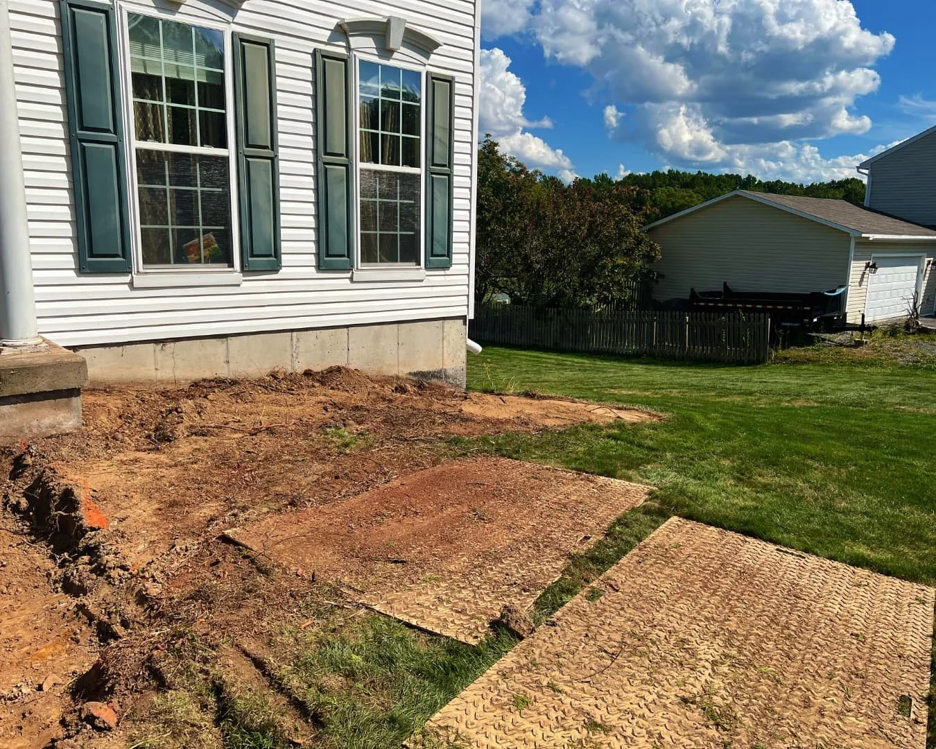 Backyard side yard before hardscape work by Pines and Pavers in Baldwinsville, New York.