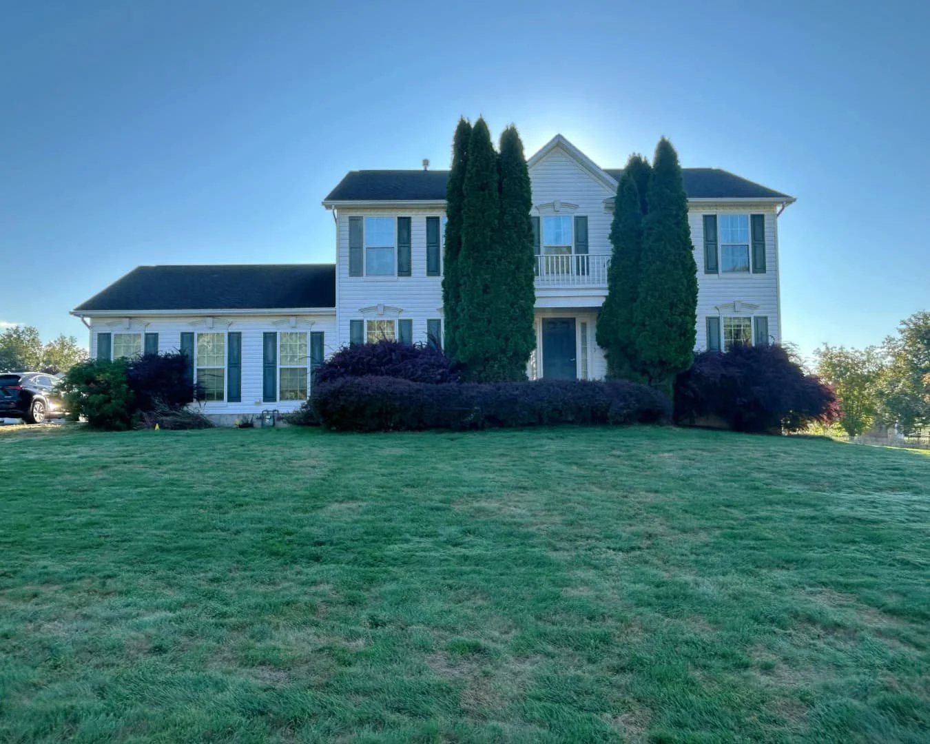 Front home overview before the landscape project by Pines and Pavers in Baldwinsville, New York.