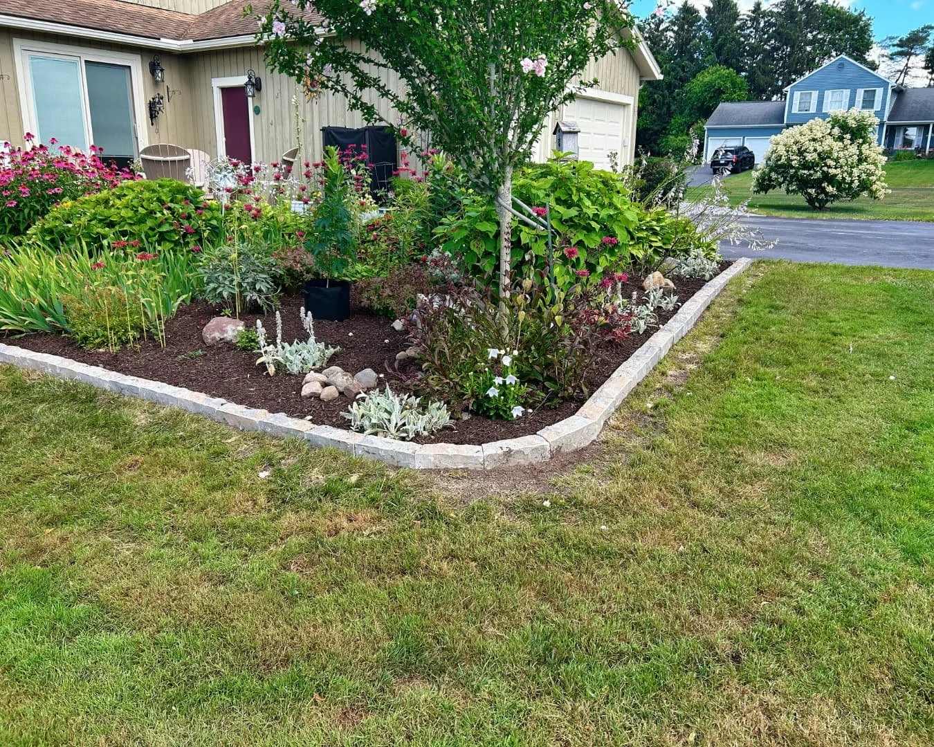 Curved edging and lawn border completed by Pines and Pavers in Skaneateles, New York.