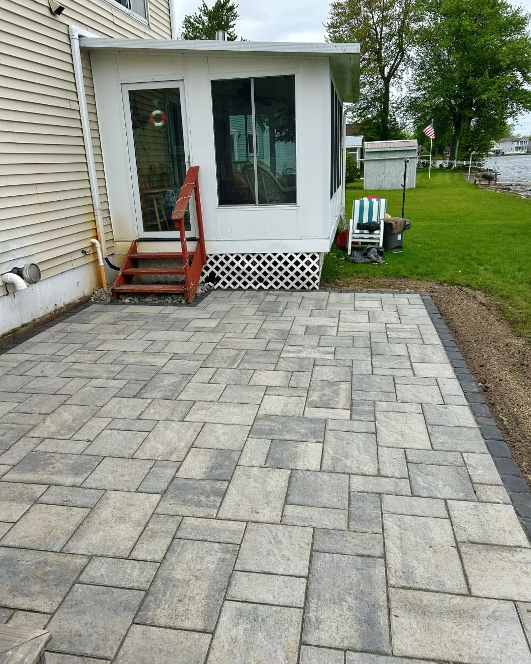 Completed square paver patio by Pines and Pavers in Marcellus, New York.