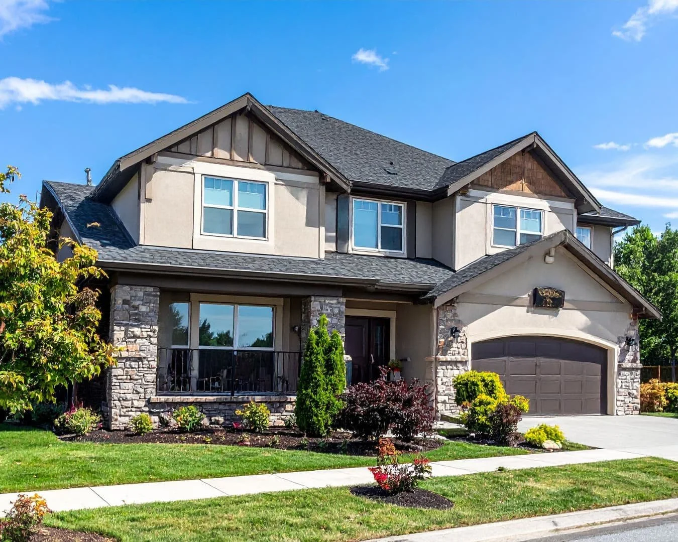 Curb appeal inspiration with a clean front yard layout, foundation planting, and a finished residential streetscape.