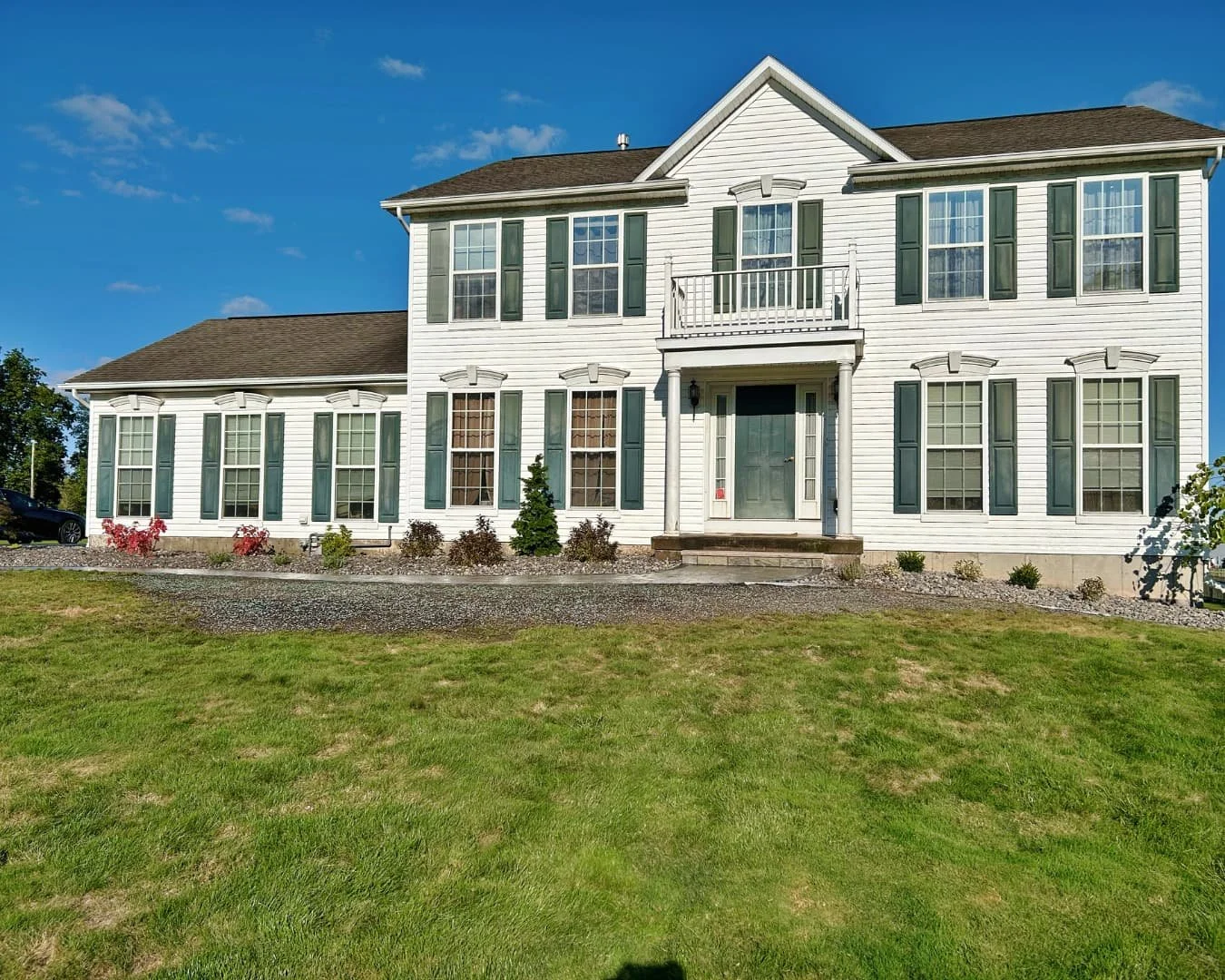 River rock landscape overview completed by Pines and Pavers in Baldwinsville, New York.