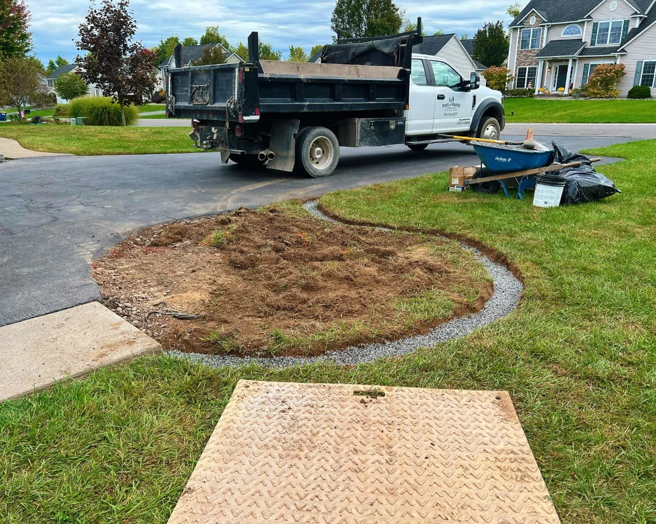 Grading and drainage work in progress by Pines and Pavers in Lysander, New York.