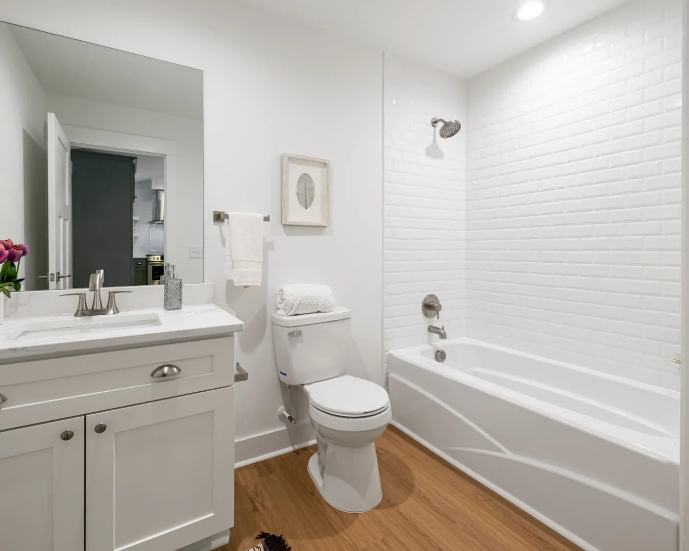 Bathroom inspiration with a bright vanity, bathtub, and clean traditional layout.