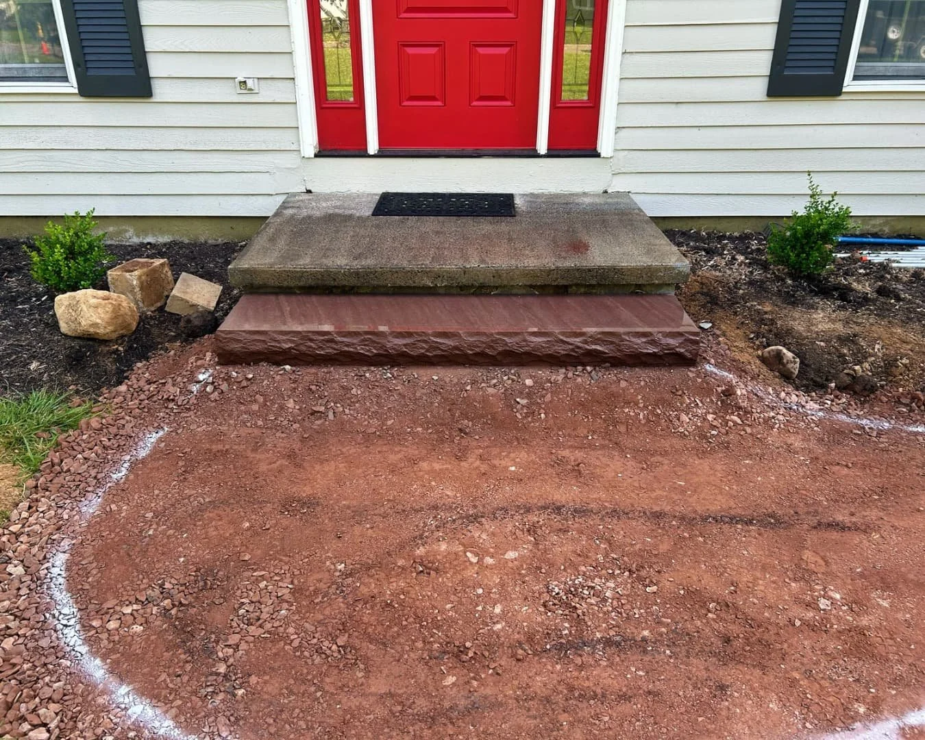Front entry before walkway installation by Pines and Pavers in Manlius, New York.