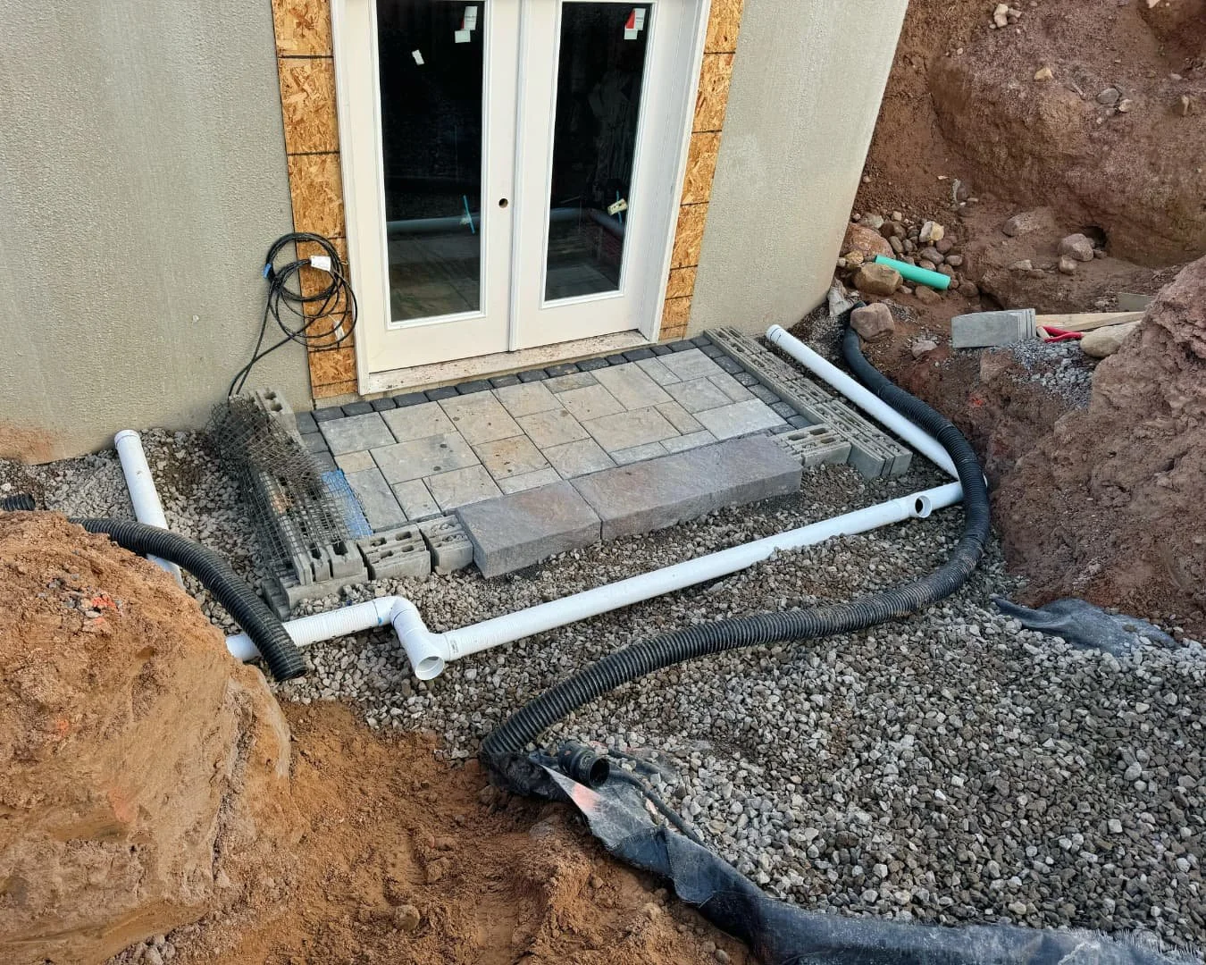 Rough grade preparation for hardscape installation by Pines and Pavers in Cazenovia, New York.