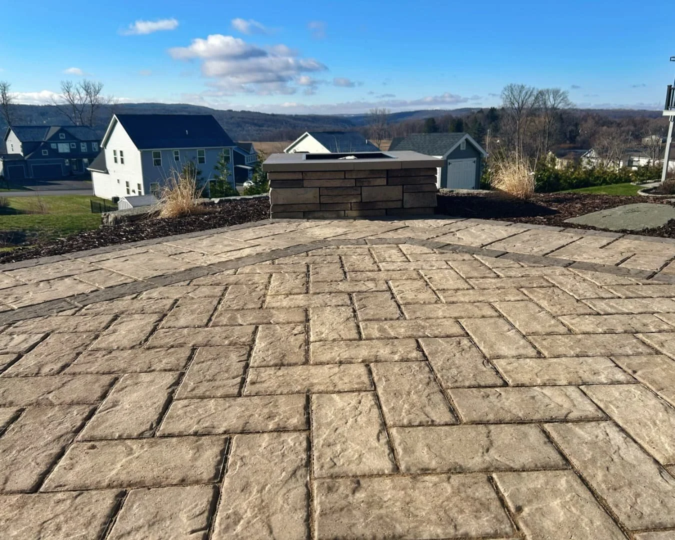 Large paver patio surface detail completed by Pines and Pavers in Lysander, New York.