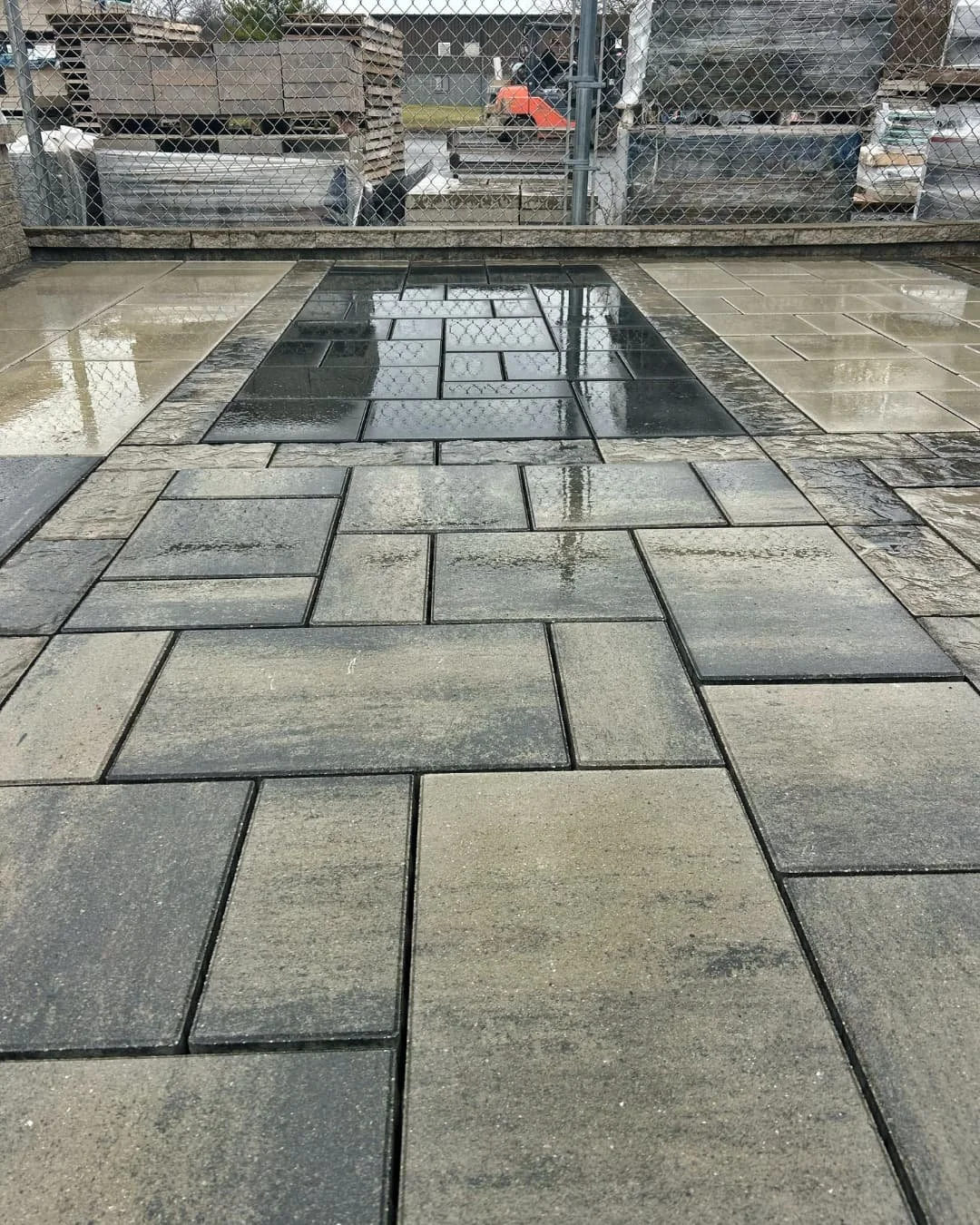 Techo-Bloc paver installation in progress at the Paragon Supply display by Pines and Pavers.