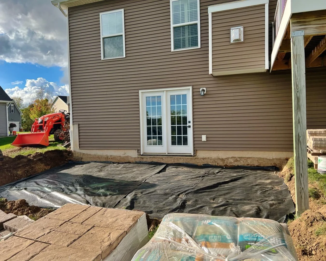 Retaining wall and patio work in progress by Pines and Pavers in Lysander, New York.