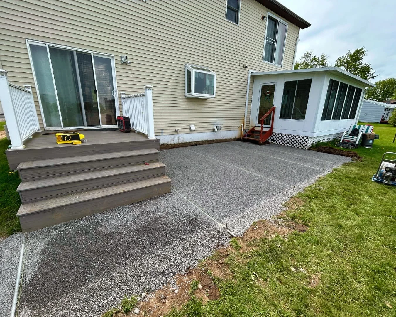 Concrete patio and steps before the project by Pines and Pavers in Marcellus, New York.
