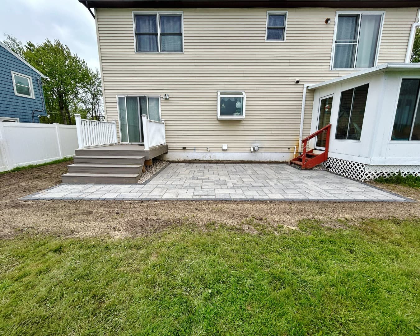 Backyard paver patio overview completed by Pines and Pavers in Marcellus, New York.