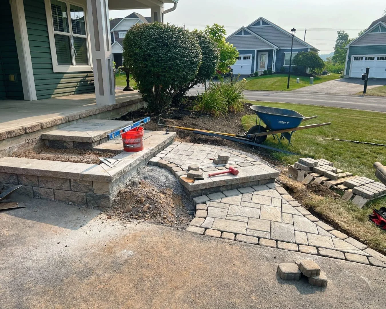 Front entry hardscape installation in progress by Pines and Pavers in Manlius, New York.