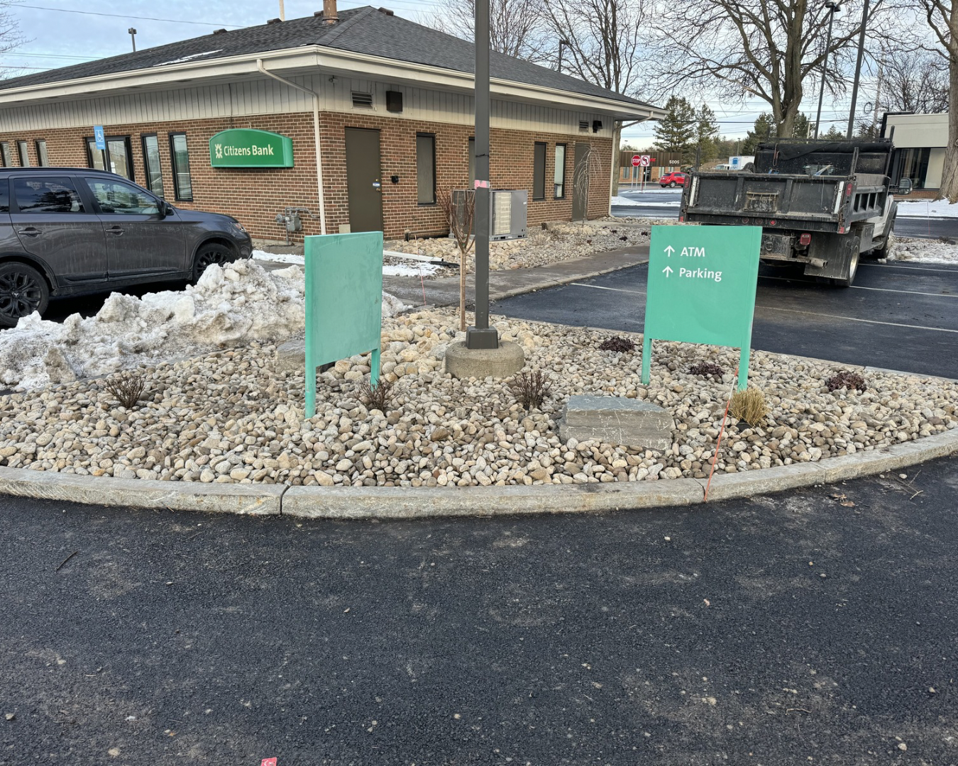 Front landscaping at a Central New York bank branch with updated beds and a clean professional appearance.