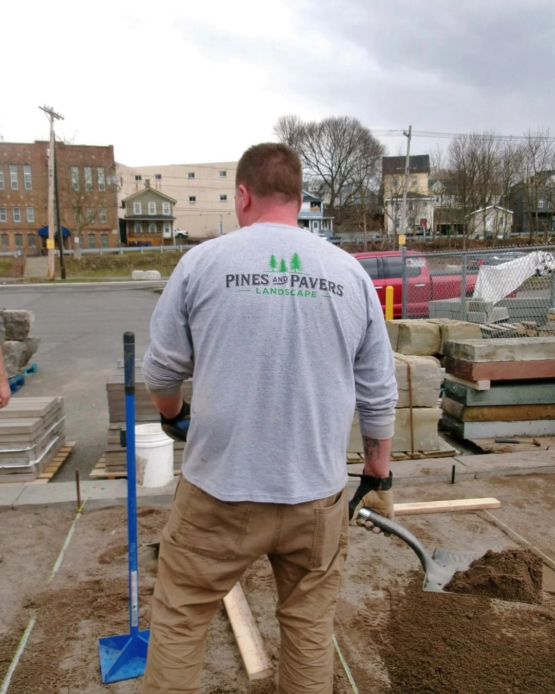 Pines and Pavers team member working on the Paragon Supply Techo-Bloc display installation.