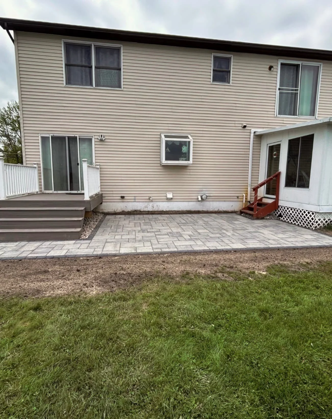 Lakeside paver patio pattern at a Central New York property with a clean geometric hardscape design.