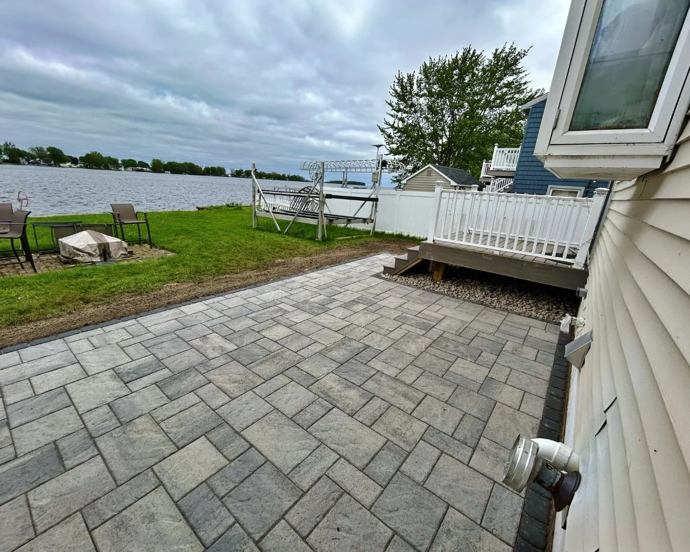Paver patio leading to the back door completed by Pines and Pavers in Marcellus, New York.