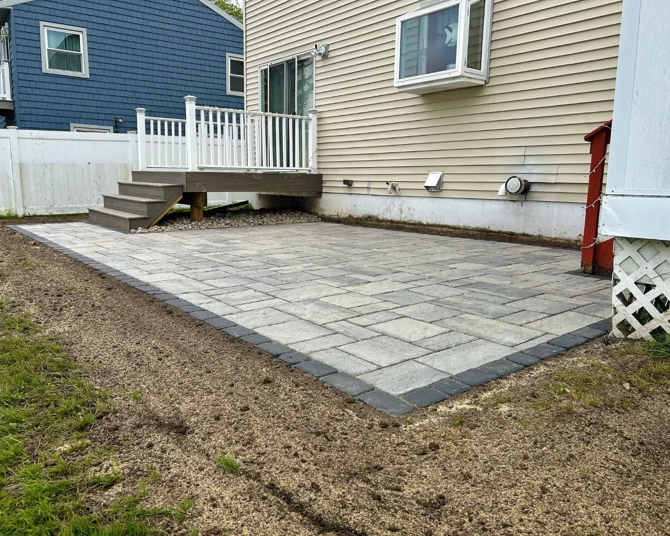 Rear paver patio and water view completed by Pines and Pavers in Marcellus, New York.