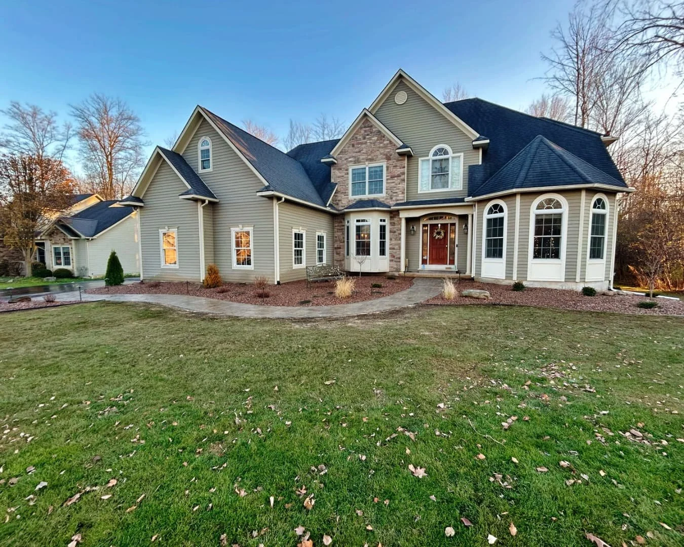 Front home landscape overview completed by Pines and Pavers in Fayetteville, New York.