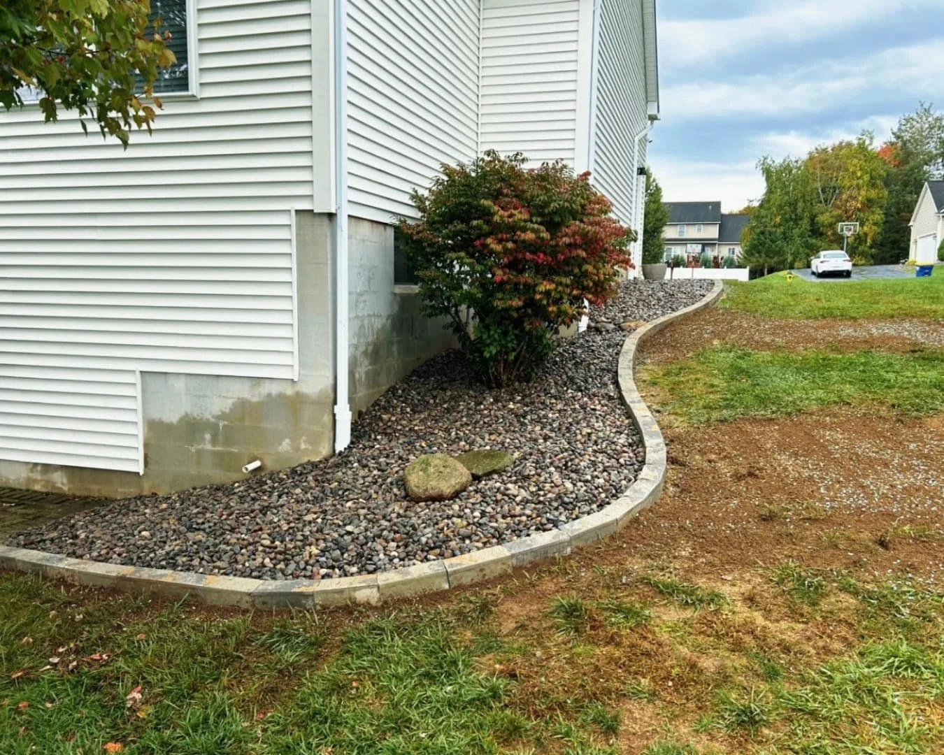 Front entry landscaping at a Central New York home with updated mulch beds and clean lawn transitions.