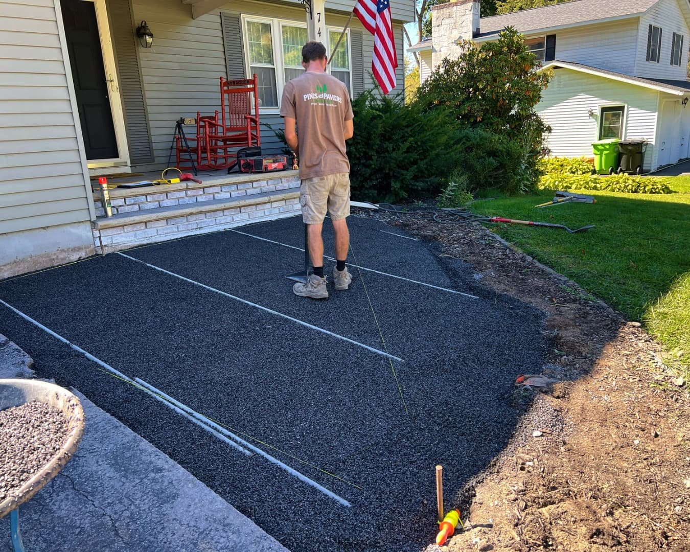 Front patio and walkway installation in progress by Pines and Pavers in Skaneateles, New York.