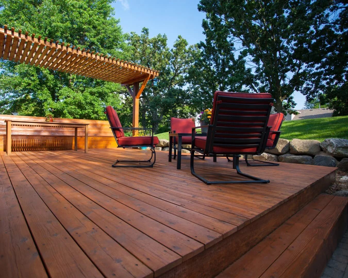 Wood deck inspiration with outdoor seating and an open backyard layout for gathering and entertaining.