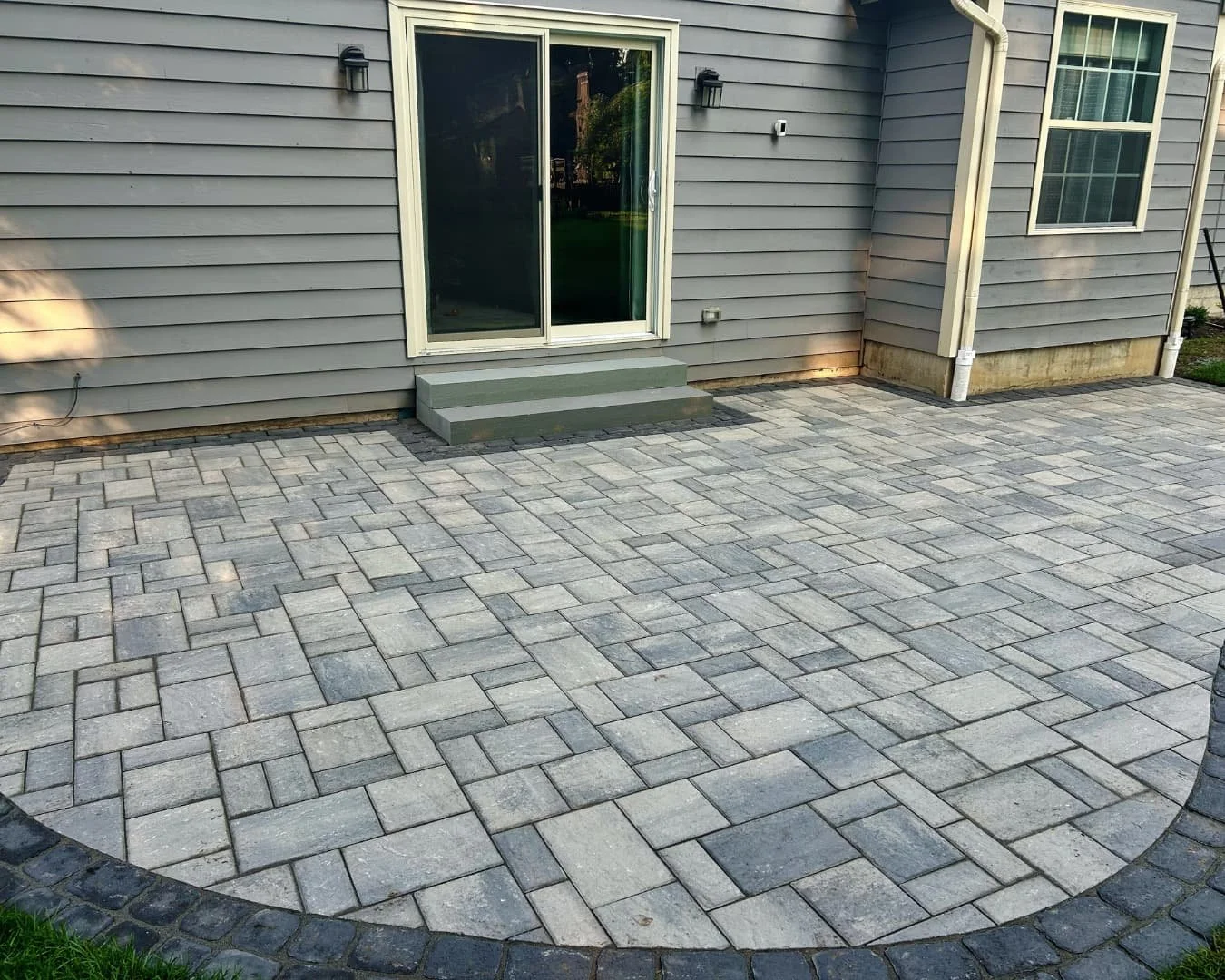 Rear patio surface detail completed by Pines and Pavers in Baldwinsville, New York.