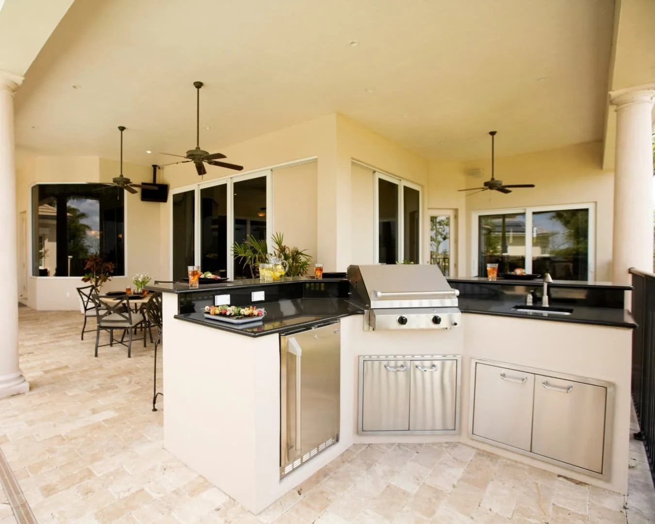 Outdoor kitchen inspiration with a built-in grill and counter layout integrated into a patio setting.