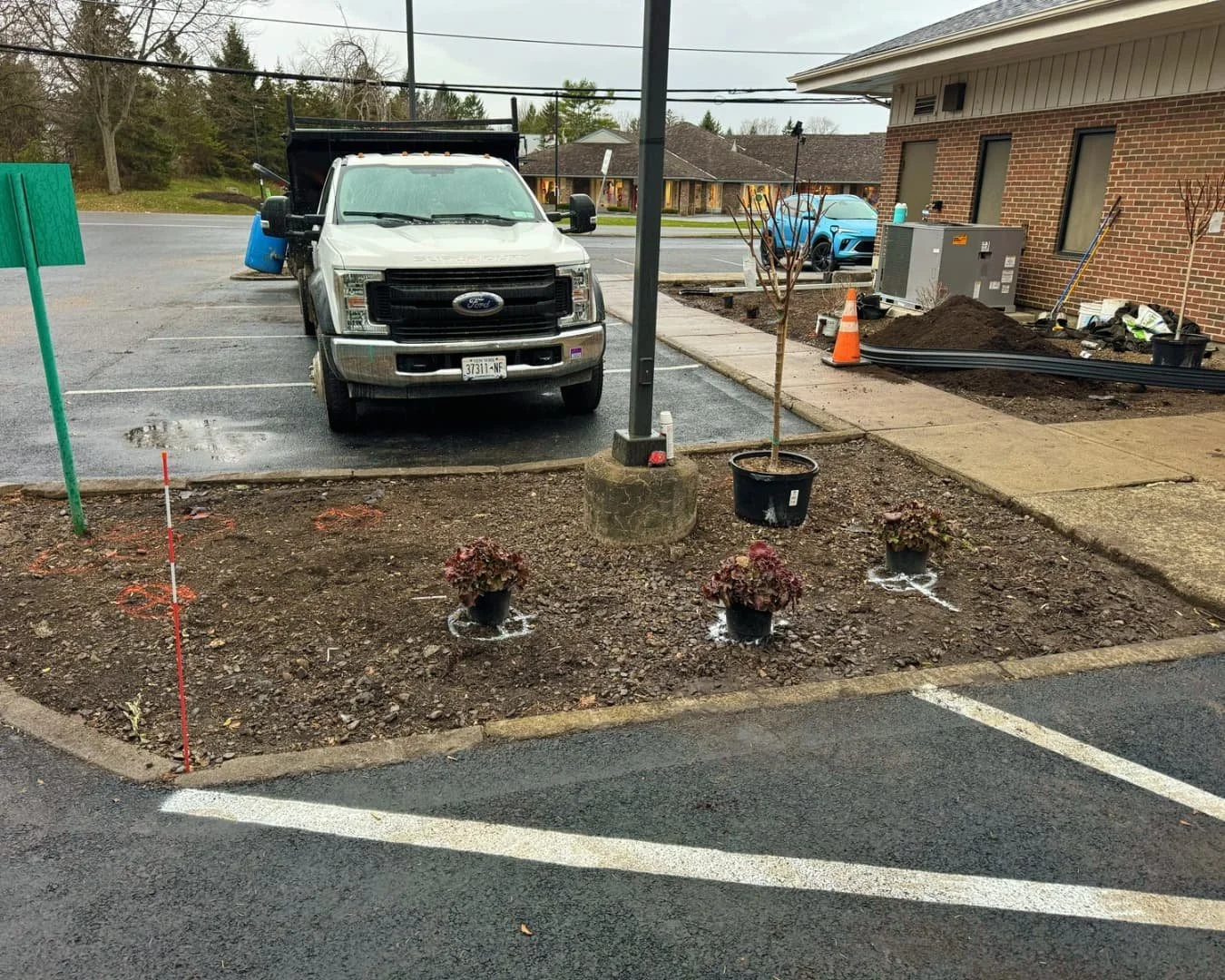 Front landscape bed in progress at Citizens Bank by Pines and Pavers in Cicero, New York.