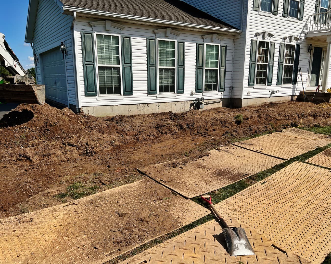 Narrow side yard path before the project by Pines and Pavers in Baldwinsville, New York.