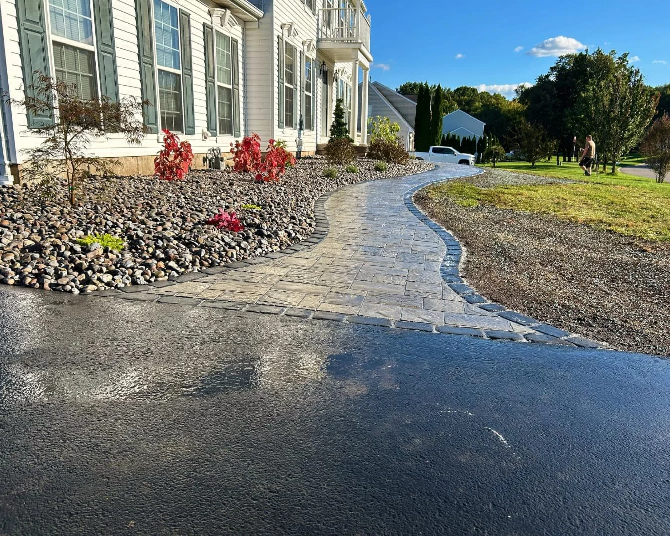 Front home landscape overview completed by Pines and Pavers in Baldwinsville, New York.