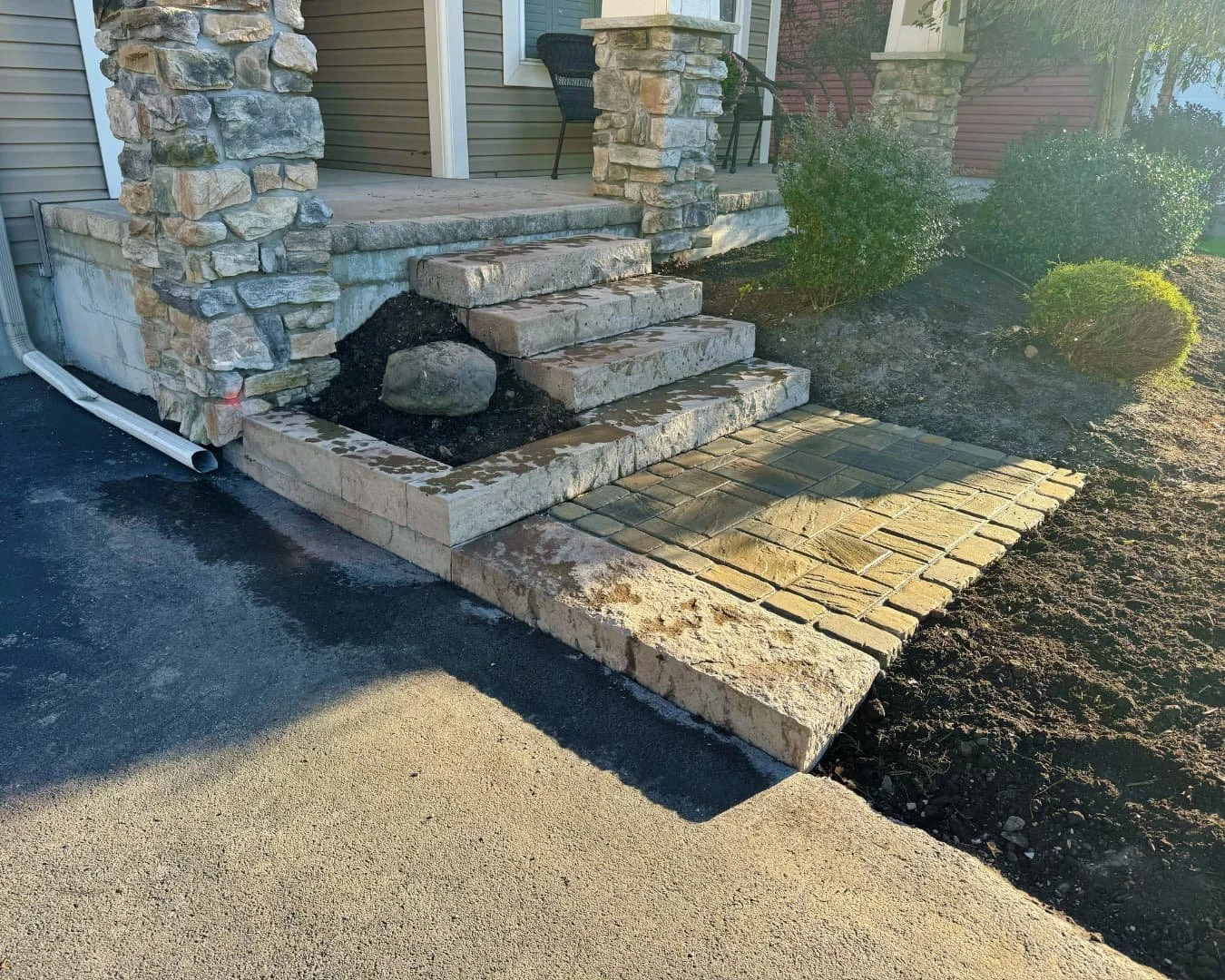 Front entry steps and landing completed by Pines and Pavers in Skaneateles Falls, New York.