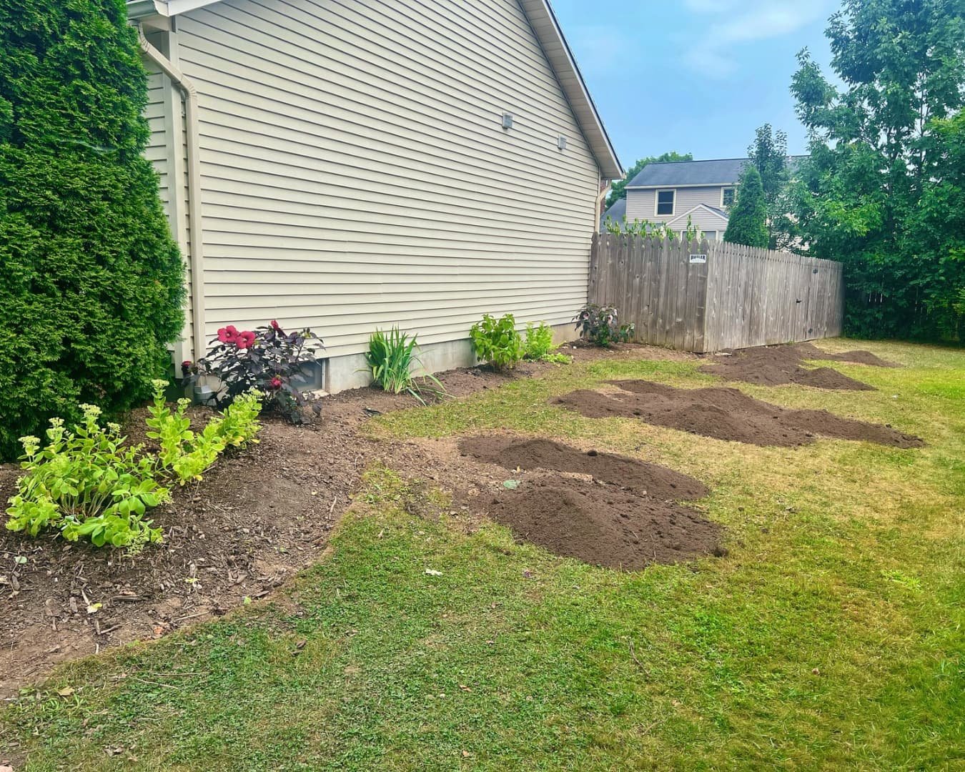 Backyard area before hardscape installation by Pines and Pavers in Baldwinsville, New York.