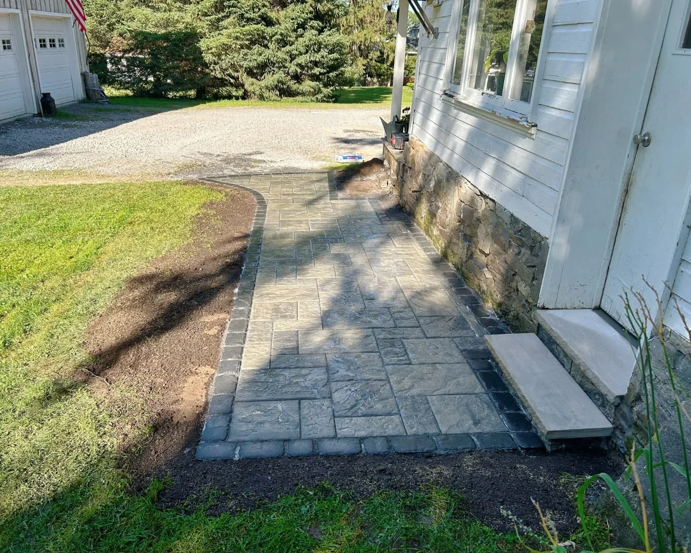 1. Curved front entry walkway completed by Pines and Pavers in Cicero, New York.