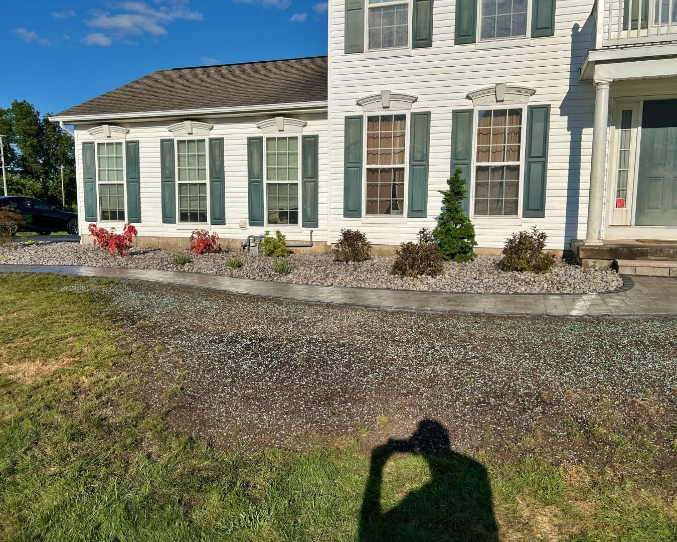 Front entry paver walkway with river rock completed by Pines and Pavers in Baldwinsville, New York.