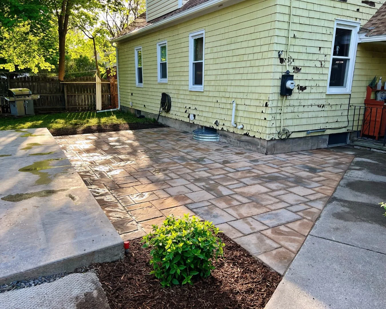 Paver walkway and side yard path completed by Pines and Pavers at a Central New York residence.