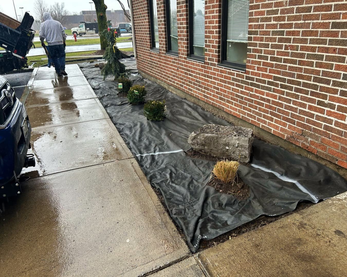 Landscape bed installation at Citizens Bank completed by Pines and Pavers in Cicero, New York.