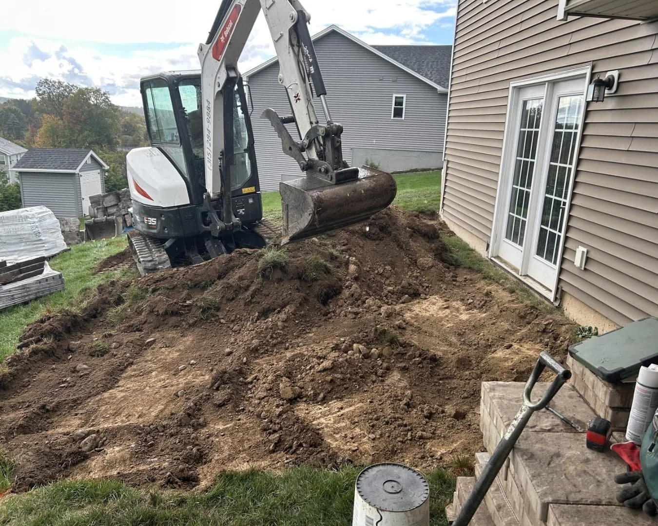 Fresh mulch bed and ornamental tree detail at a Baldwinsville, NY landscaping and hardscape project.