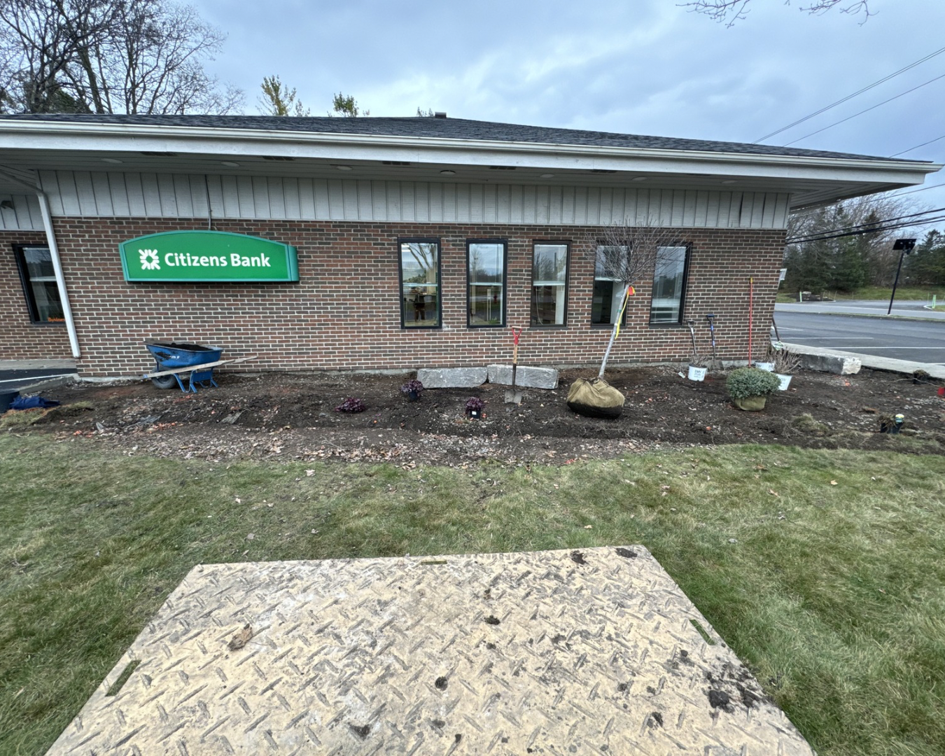 Front landscaping at a Central New York bank branch with updated beds and a clean professional appearance.