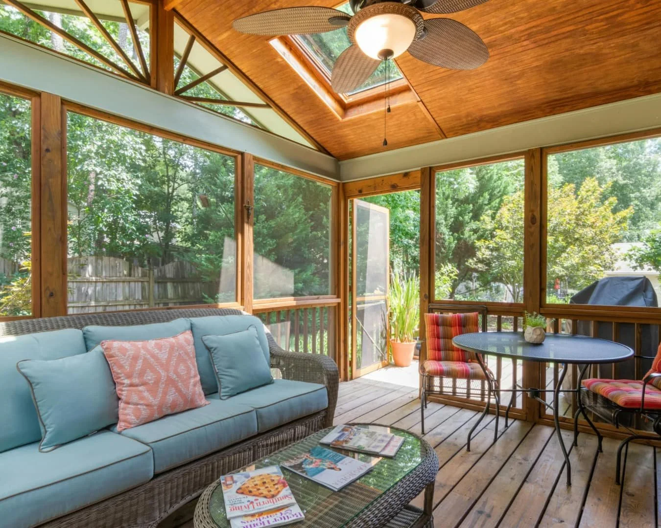 Cozy sunroom inspiration with wraparound windows, casual seating, and a peaceful outdoor connection.