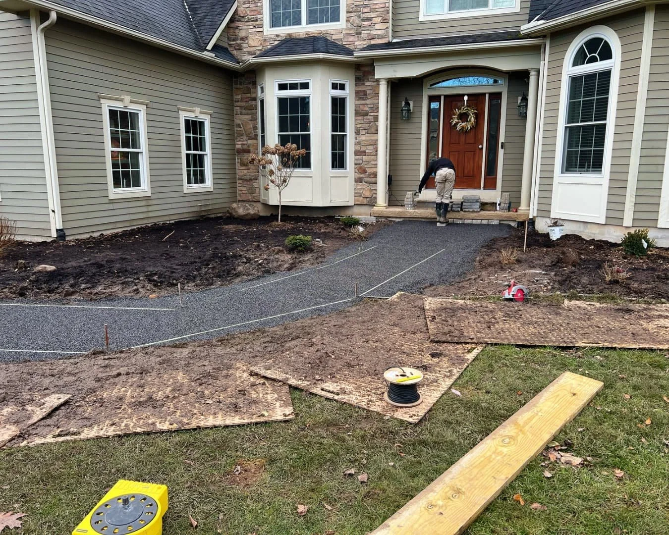 Front entry site work and excavation by Pines and Pavers in Fayetteville, New York.