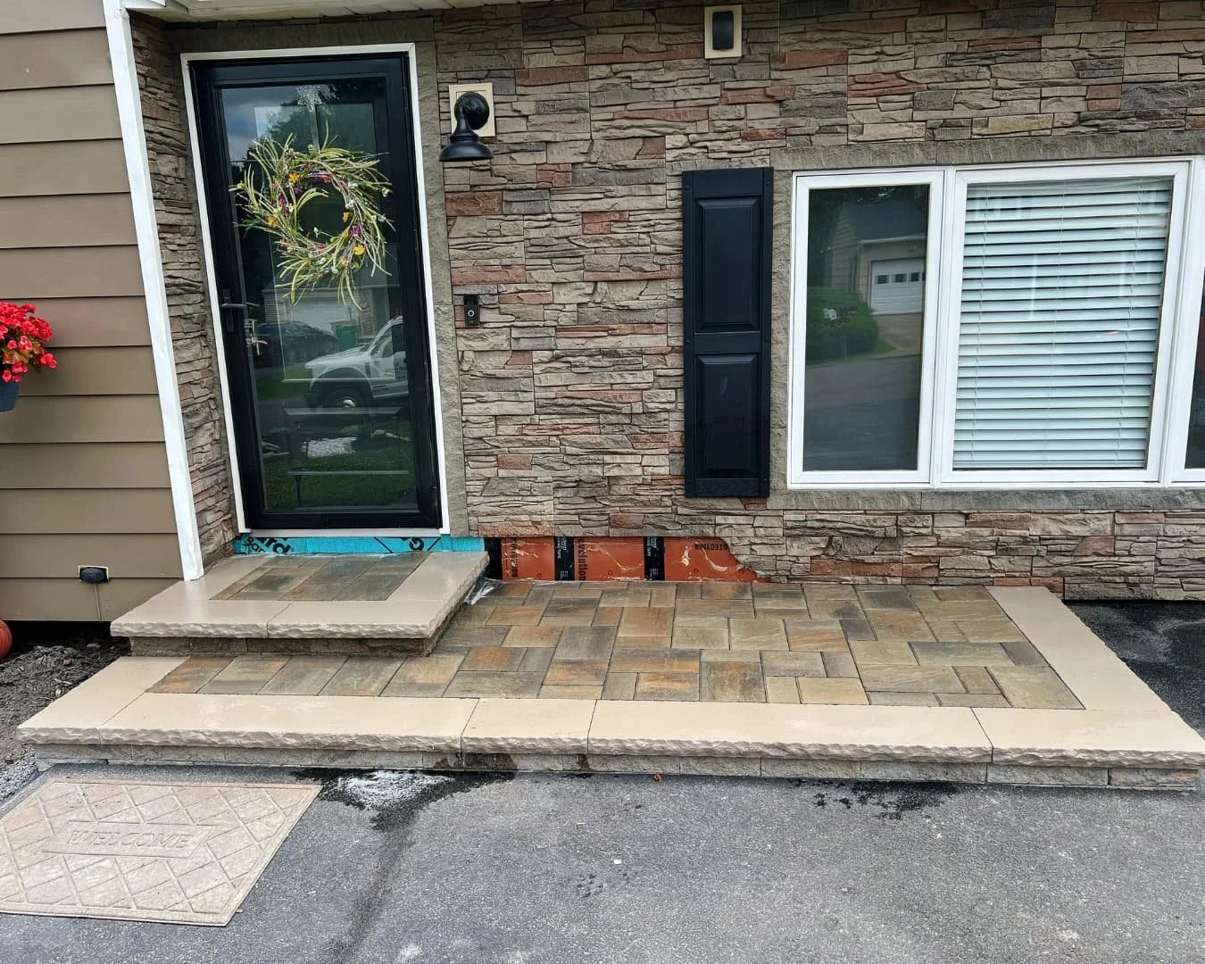 Front entry paver patio in progress by Pines and Pavers in Camillus, New York.