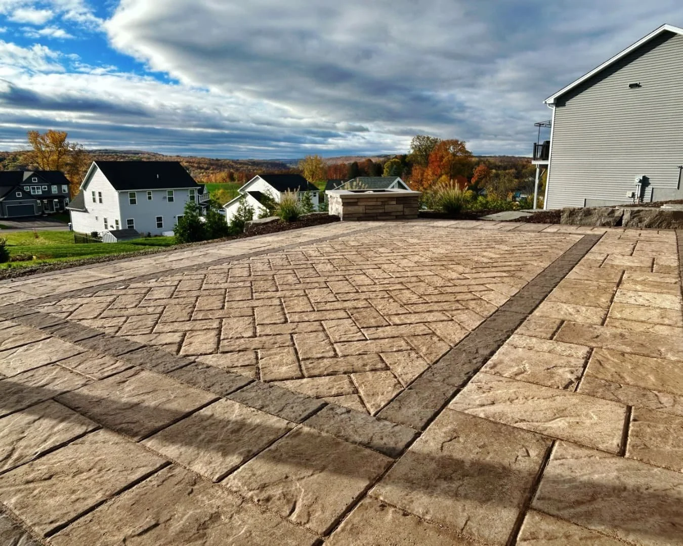 Paver patio field and inlay detail completed by Pines and Pavers in Lysander, New York.