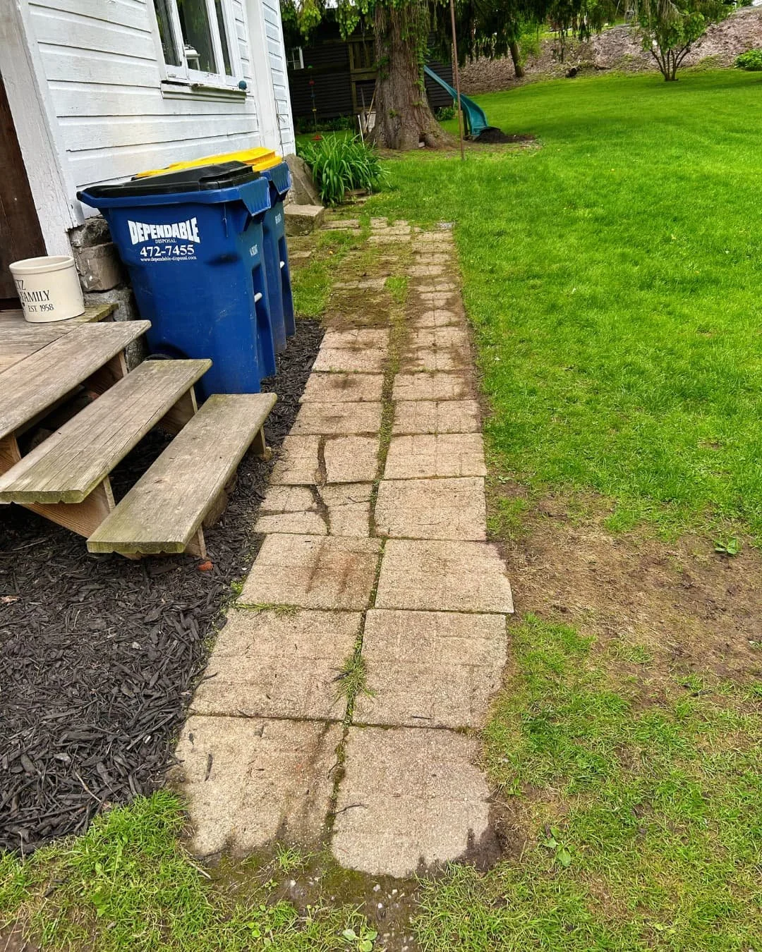 Existing side walkway and steps before the project by Pines and Pavers in Cicero, New York.