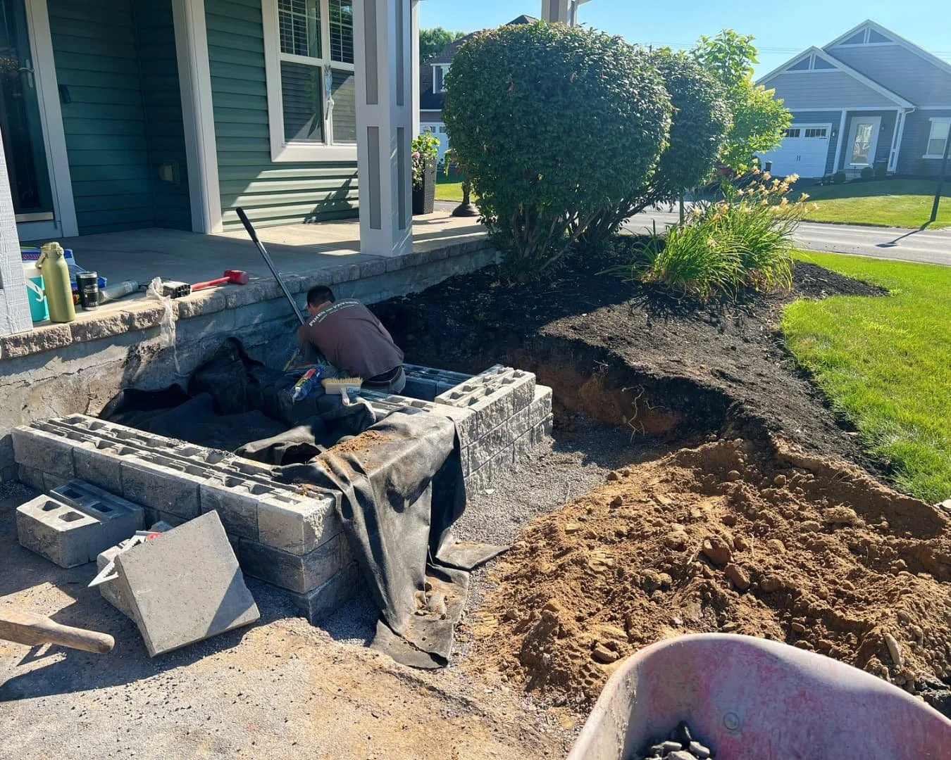 Front entry excavation before hardscape installation by Pines and Pavers in Manlius, New York.